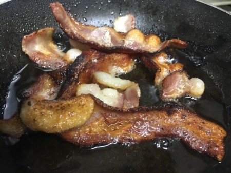 cooking bacon in pan