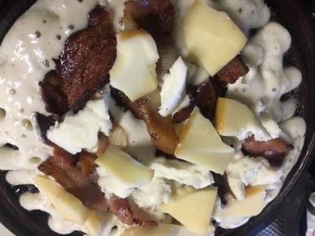 add cheese to bacon and batter in waffle iron