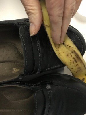 Using a banana peel to shine your leather shoes.