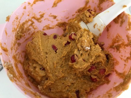 adding cranberries to muffing batter