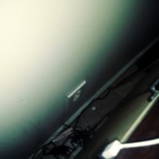 picture of an outlet behind furniture.