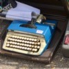 Repairing a Broken Smith Corona Typewriter Carriage - blue typewriter