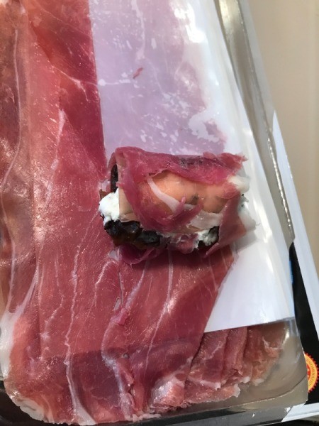 wrapping Stuffed Dates with prosciutto