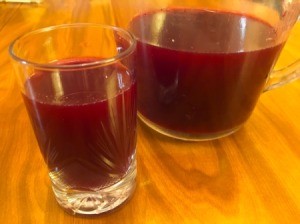 Juicing and Growing Your Own Pomegranates - container and glass of fresh juice