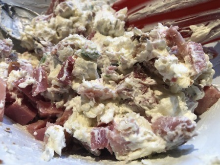adding ham to cream cheese mixture