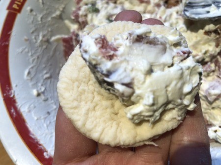 adding filling to dough circles