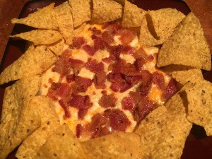 Baked Three Cheese Bacon Dip surrounded by chips