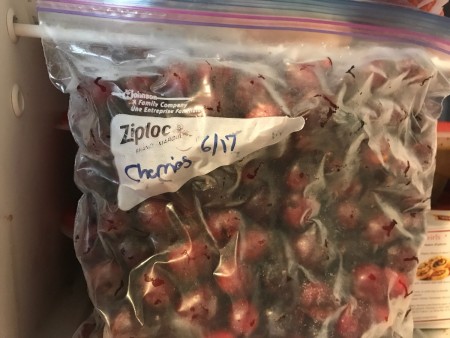 Cherries stored in a ziptop freezer bag.