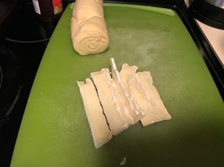Brie sliced in to small sections.