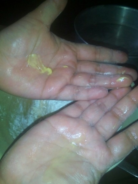 buttering hands to handle dough