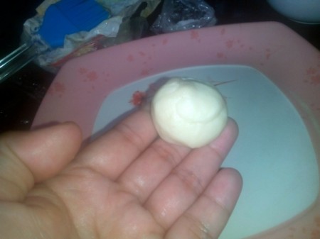 ball of dough in hand