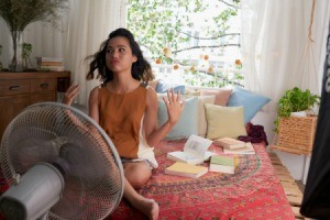 Woman Trying to Cool Off on Hot Summer Day