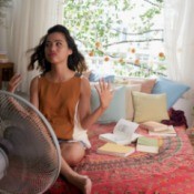 Woman Trying to Cool Off on Hot Summer Day