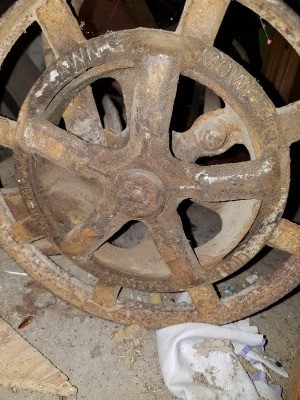 A wheel of a reel mower.