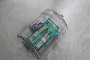 A jar filled with chewing gum packets.