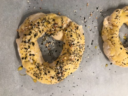 bagels with egg and seeds on top