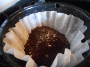 A filled coffee filter with baking soda added.