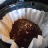 A filled coffee filter with baking soda added.
