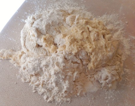 adding flour to dough