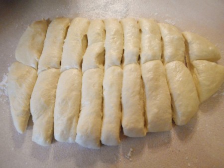 cutting rolls from flattened dough