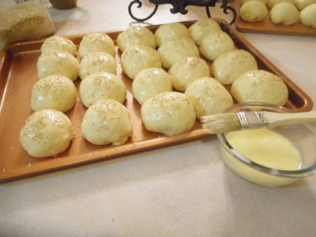 risen rolls on cookie sheet