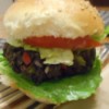 Black Bean Veggie Burger in bun with tomato and lettuce