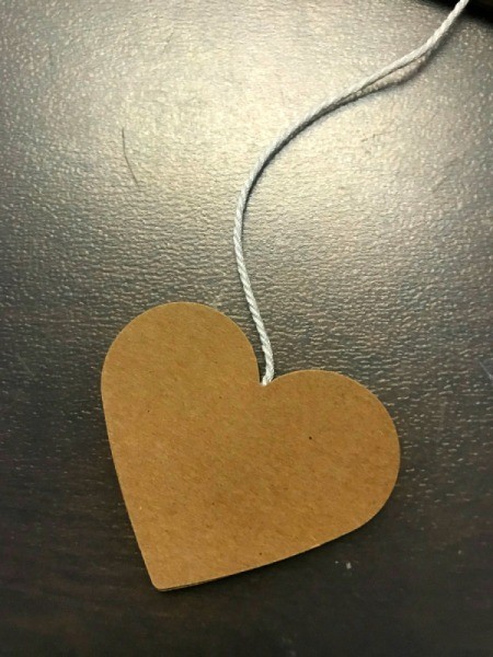 Valentine's Day Tissue Wreath - view of paper heart attached to twine and covered with second heart