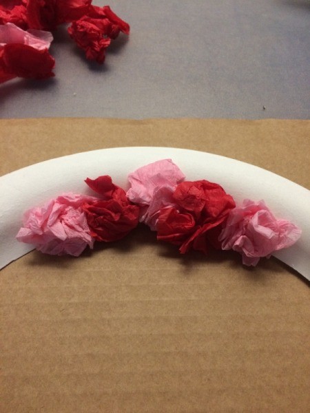 Valentine's Day Tissue Wreath - closeup of gluing on paper crumples