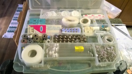 An old RC car box that has been repurposed for craft supply storage.