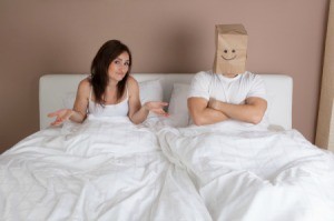 Married Couple in Bed with Bag Over Husbands  Head