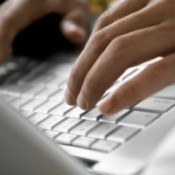 Man Typing at Computer