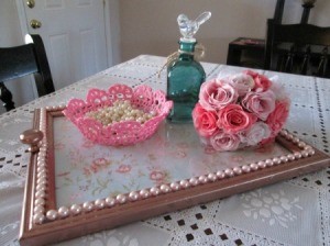 A decorative tray made from a wooden picture frame.