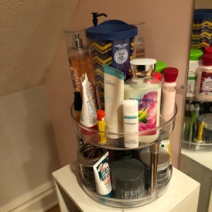 A lazy susan full of beauty products.