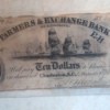1833 Farmers Exchange 10 note in poor condition.