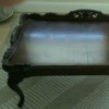 Value of Glass Top Mersman Table - dark wood ornate table