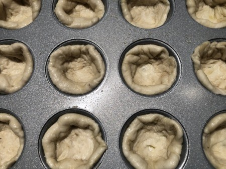 dough in muffin tins