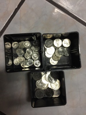 Containers of sorted coins.