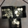 Containers of sorted coins.