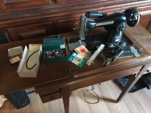 Manual for a Precision Deluxe Sewing Machine - vintage sewing machine in cabient