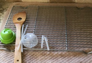 A recycled oven rack being used as a drying rack.