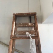 Safe Ladder Storage - ladder hanging on wall