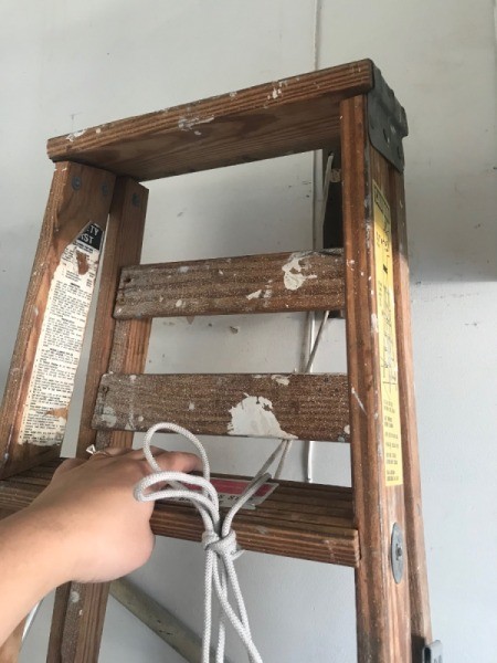 Safe Ladder Storage - tying ladder with rope