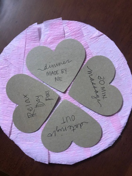 Valentine's Heart Chocolate Candy/Coupon Gift - write coupon messages on heart shapes, glue down to the crepe paper coveres circle