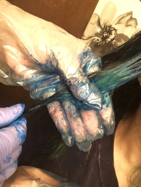 DIY Ombre Hair Colouring - using gloves work color into hair and move it up to and slightly past the first color for a good transition, leave in according to instructions and then rinse