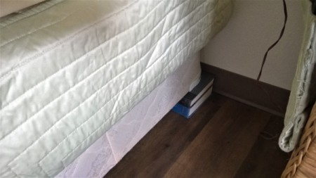 Books under corner of Bed