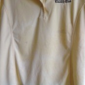 A golf shirt with stains.