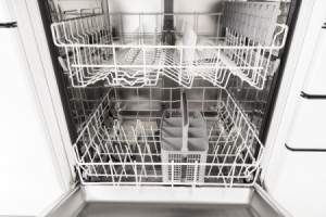 An empty dishwasher with the door open.