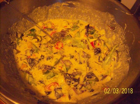 adding greens to egg mixture