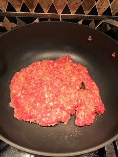 Sausage cooking in pan