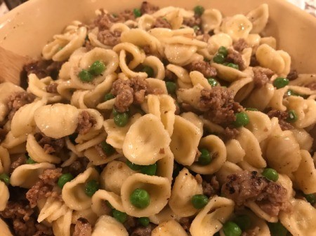 pasta mixed with sausage pea mixture